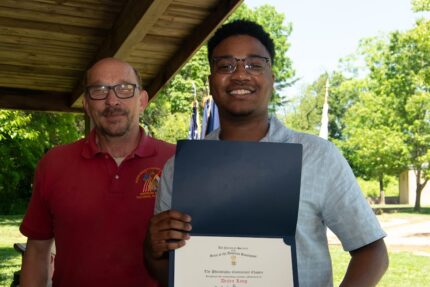 Dezlen Long receiving the 2026 Greenspan Scholarship Award.