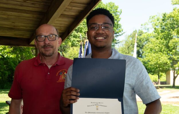 Dezlen Long receiving the 2026 Greenspan Scholarship Award.